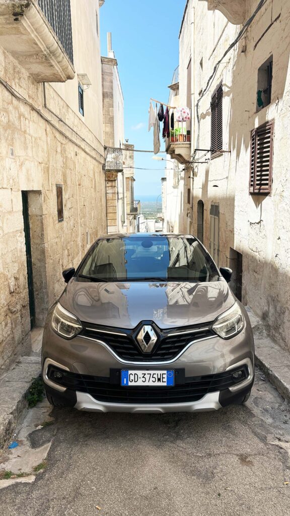Car parked blocking the narrow old roads in Ostuni Italy