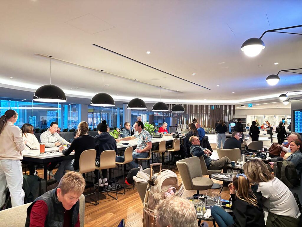 Crowds in the WestJet Elevation Lounge at YYC