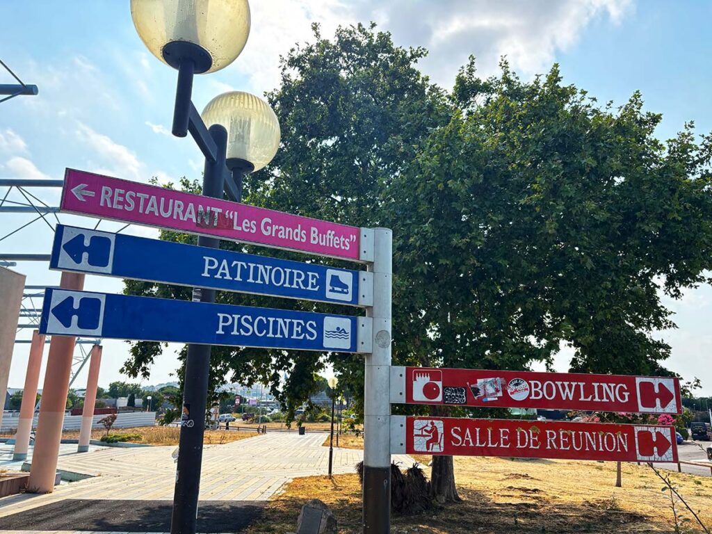 Sign Pointing Towards Les Grands Buffets de Narbonne Restaurant in France