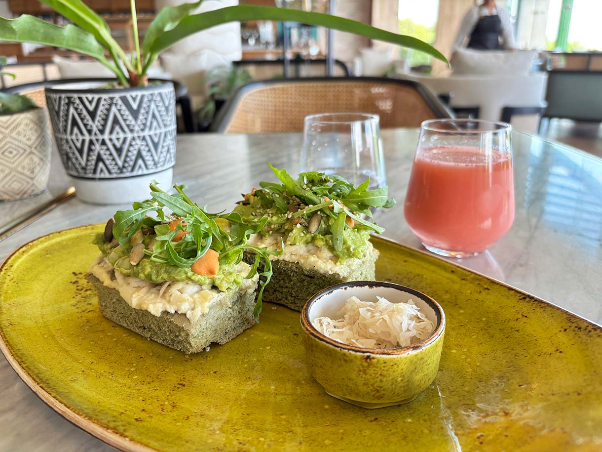 Vegan Playa Toast and Fresh Fruit Juice at Plantissa Cafe at at Palmaia the House of Aia Resort in Mexico