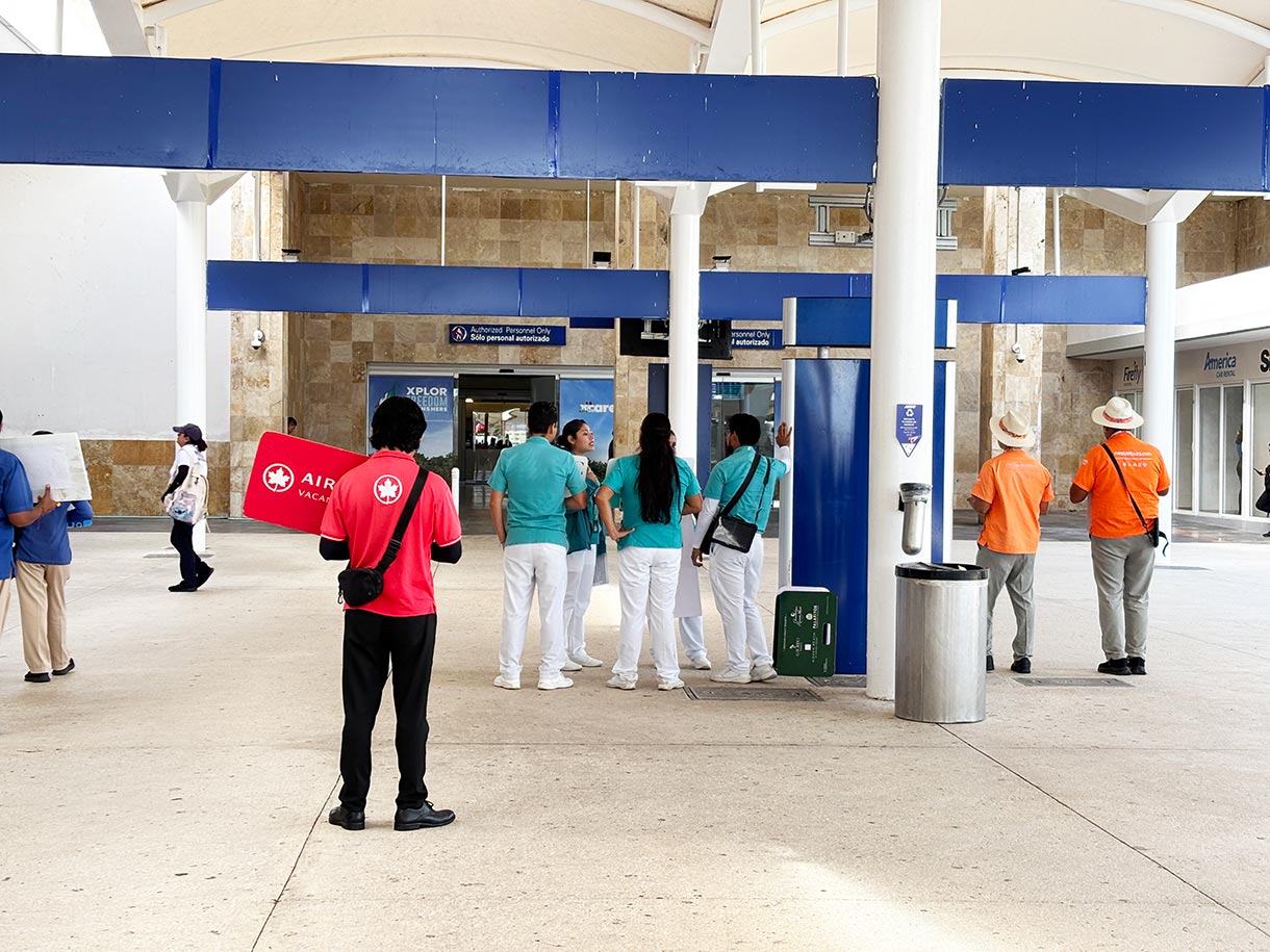 Vacation Reps Greeting Arriving Travelers at Cancun Airport